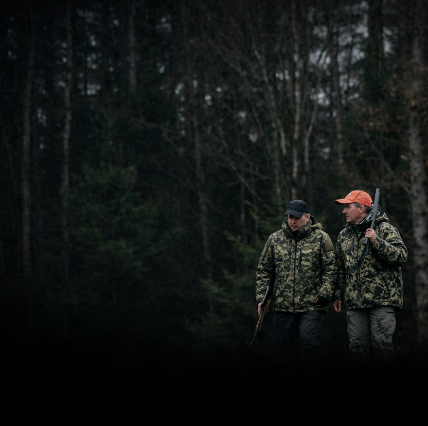 Two hunters wearing Ptarmon camouflage in the woods